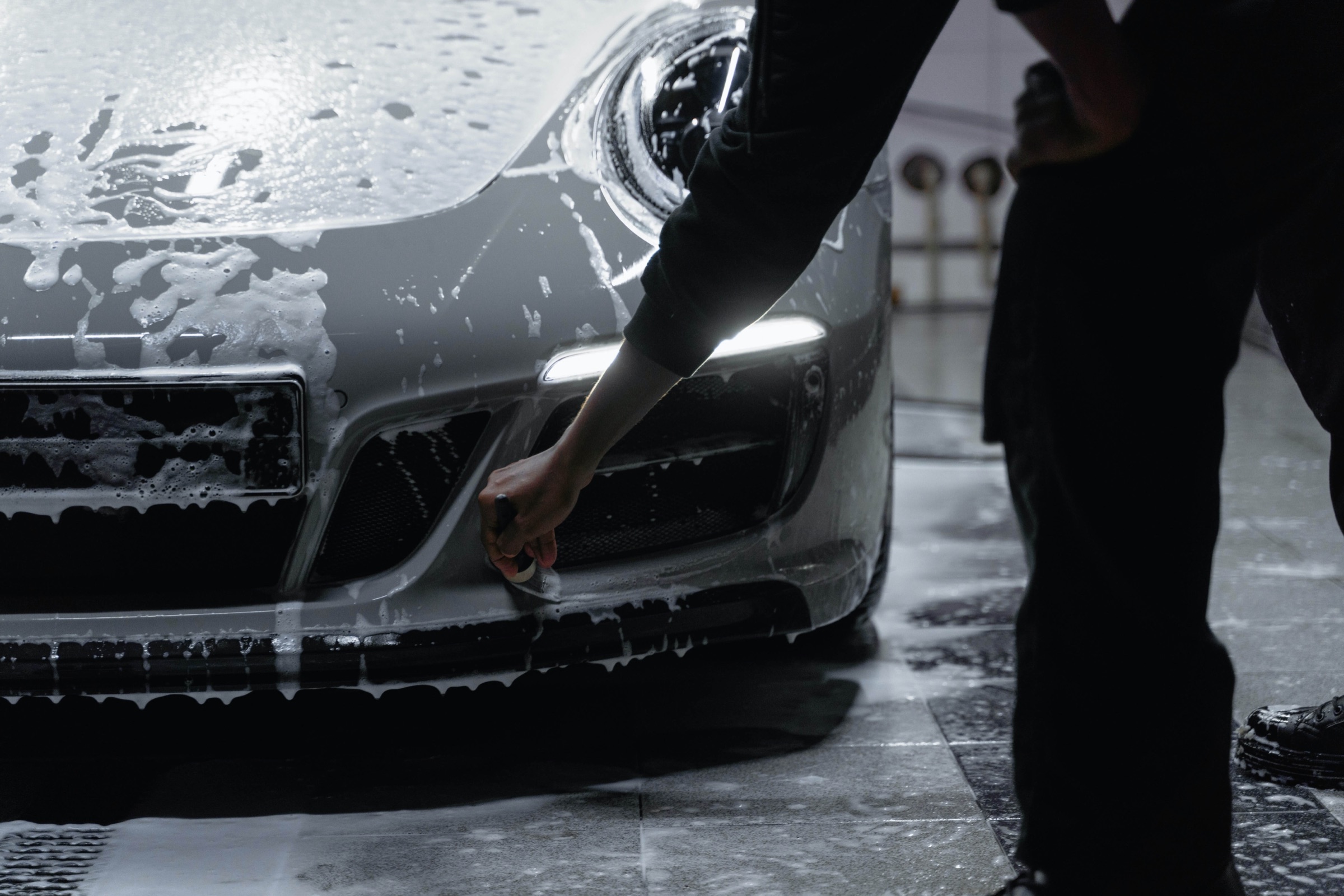 Josh of Ex Machina Detailing washing a car with a foam cannon